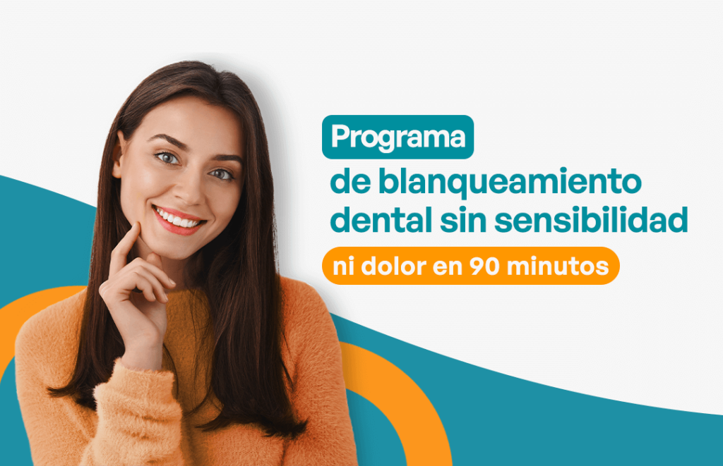 Mujer joven mostrando su sonrisa radiante tras un blanqueamiento dental indoloro